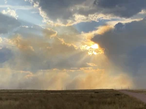 Image of the sun peaking through clouds in Casper WY
