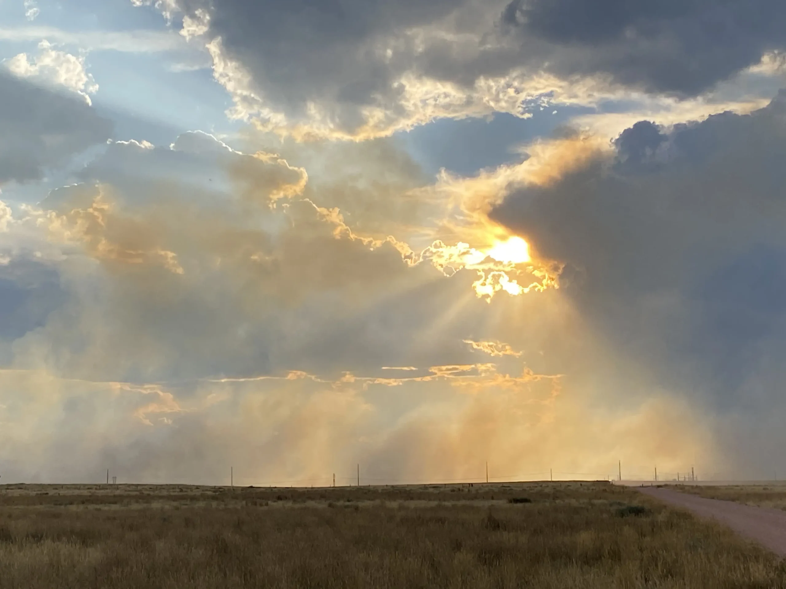 Image of the sun peaking through clouds in Casper WY