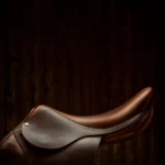 Image of a horse saddle with a dark background